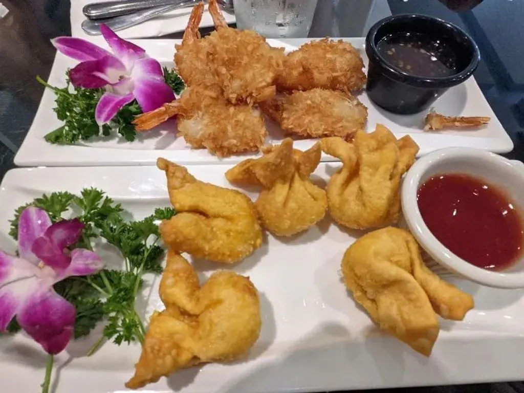 Combination platter of coconut shrimp and crab rangoon with dipping sauces at Green Papaya Thai Cuisine, a Thai Restaurant in Jacksonville